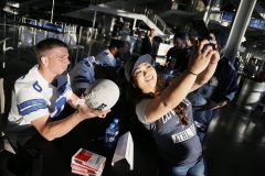 Cowboys fan Chrystal Fejeran from Houston, photographs her picture with Cowboys #6 Chris Jones after getting his autograph during the Cowboys draft party at AT&T Stadium in Arlington, TX on April 30, 2015. (Kye R. Lee/The Dallas Morning News)
