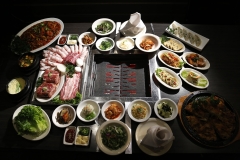 A grill table set with Combo Modum BBQ, many banchan (small side dishes) and other dishes at Gui-Rock Korean BBQ in Carrollton, TX on September 24, 2013  (Kye R. Lee/The Dallas Morning News)